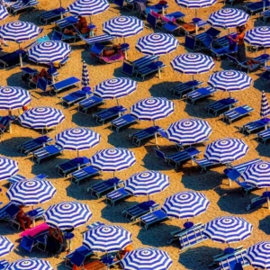 Aerial view of striped beach umbrellas