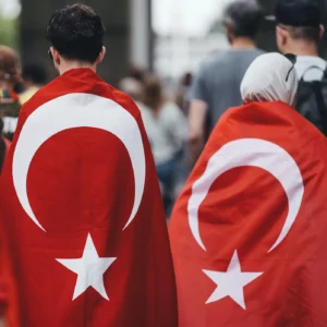 Fans wearing Turkey flag body flags as capes