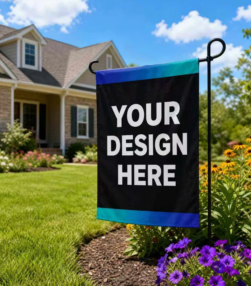 Custom garden flag displayed in a front yard flower bed