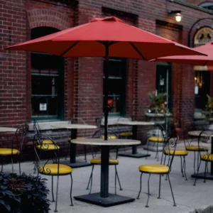 Red patio umbrella over a restaurant terrace